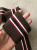 Подвяз коричневый с полосами белый/красный/черный (полиэстер), размер 7,5*32 см ПКК/32/78082 по цене 123 руб./штука