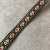 Тесьма коричневая орнамент розовый цветок, зеленый край, ширина 1,2 см ТКК/12/70 по цене 38 руб./метр