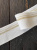 Подвяз молочный с золотистой полосой с люрексом (комфортный полиэстер), 4*95 см ПКМ/40/49109 по цене 325 руб./штука