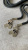 Шнурок черный, наконечник металл цвет серебро (подвеска "мишка с бантом"), длина 135 см ШКЧ/135/46914 по цене 265 руб./штука