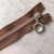 Молния коричневая неразъемная с кольцом, 18 см Звено 5 серебро МКК/18/7287 по цене 395 руб./штука