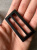 Пряжка черно-коричневая (пластик), размер 2,8*5,5 см (под пояс 4,5 см) Италия ПИК/45/22835 по цене 69 руб./штука